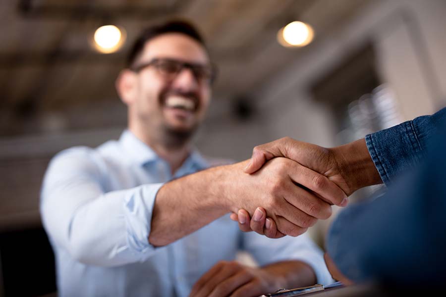 Two people shaking hands